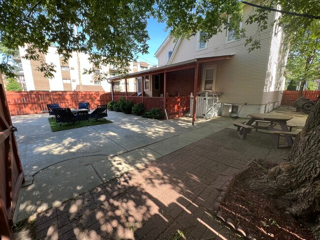Enclosed porch, multiple seating areas - 1396 Brown St
