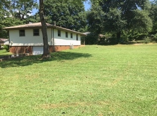 Back of yard. There is a small garage and second driveway that goes into the basement that can be used as a workshop. There is no access from the basement to the main part of the house. - 2413 Sherwood Place