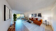 Located at 2900 St Paul Dr in Santa Rosa, CA, this 2-bedroom, 3-bathroom single-floor residence offers a well-designed layout with modern finishes throughout. The bright and open living room features light wood-style flooring, a textured ceiling, and large sliding glass doors that lead to a private balcony overlooking lush greenery, filling the space with natural light and outdoor views. The galley-style kitchen is thoughtfully updated with white shaker cabinetry, black hardware, quartz countertops, stainless steel appliances including a gas range and built-in microwave, and a deep sink with a matte black faucet. A skylight above the kitchen and adjacent dining area enhances the sense of openness. The primary bedroom offers comfortable carpeted flooring, mirrored closet doors, and includes an in-unit stacked washer and dryer. Its en-suite bathroom features a dual-sink vanity with white cabinetry and a walk-in shower. The second bedroom is carpeted and benefits from a natural light source via a window with blinds. Additional bathrooms are finished in a clean, contemporary style with wood-look flooring, white fixtures, and black accent hardware. Two hallways connect the layout efficiently, contributing to a cohesive and functional flow throughout the home.