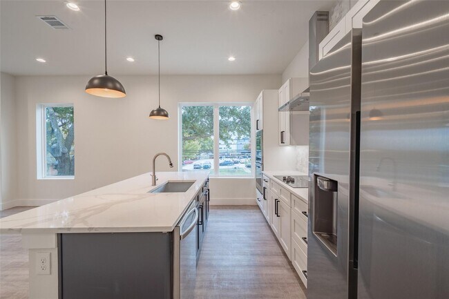 Building Photo - Modern 4-Level Corner Condo with Rooftop Deck & Downtown Views – 2BR/2.5BA + Flex Spaces, 2-Car G...