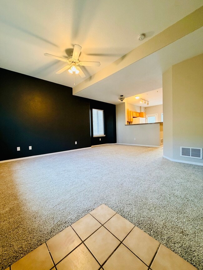 Main-level living area with open view toward kitchen, actual photo - 2563 Malpaso Pt