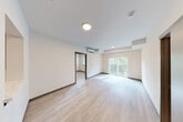 Located at 4901 S 25th St in Tacoma, WA, this well-designed 2-bedroom, 1-bathroom unit offers a thoughtful single-floor layout with modern finishes throughout. Light wood-tone luxury vinyl flooring flows seamlessly across all rooms, lending a clean, cohesive aesthetic to the space.

The kitchen is a functional highlight, featuring light wood grain cabinetry, quartz-style countertops, stainless steel appliances including a refrigerator, range, and dishwasher, and a single-basin sink. Recessed lighting illuminates the space efficiently, and ample upper and lower cabinet storage ensures practical use of every inch.

The open living area is bright and airy, with a large sliding glass door leading to a private balcony that frames views of surrounding mature trees. A wall-mounted mini-split unit provides climate control. The primary bedroom offers a comfortable footprint with a window overlooking lush greenery. The second bedroom features the same light flooring and neutral walls.

Four closets, including wire-shelved storage areas, provide generous organization throughout. The full bathroom includes a vanity with storage, toilet, and a tub-shower combination. A dedicated laundry area adds everyday convenience. The overall design is clean, contemporary, and move-in ready.