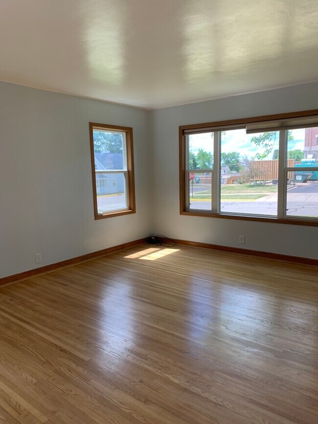 Large living room with ample natural light. - 246 S 3rd St