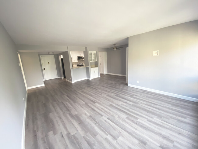 Living Room open to kitchen. Seats two barstools comfortably - 5625 Green Valley Cir