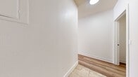This 340 square foot apartment in Marina Del Rey offers a thoughtful layout maximizing space efficiency. The unit features two well-appointed bathrooms, enhancing convenience for residents and guests. The kitchen is a standout, boasting modern wood cabinetry, stainless steel appliances, and a stylish subway tile backsplash. The combination of wood-look flooring and tile creates visual interest and defines spaces within the open plan.

The bathrooms are designed with practicality in mind, featuring a tub-shower combination, ample storage in a wood vanity, and large format tile flooring. Modern fixtures, including a sleek towel bar and toilet paper holder, add a touch of contemporary style.

Despite its compact size, the apartment includes a dedicated closet space, crucial for storage in a smaller living area. The overall design aesthetic is clean and minimalist, with white walls providing a bright, airy feel throughout. Natural light appears to be a feature, with windows visible in the kitchen area.

While the apartment is cozy, its thoughtful design and prime Marina Del Rey location make it an attractive option for those seeking a modern, low-maintenance living space in a desirable area.