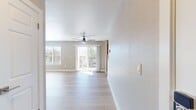 This contemporary 570 square foot apartment in the Highlands of Marin offers a thoughtful blend of style and functionality. The open-concept layout maximizes the use of space, seamlessly connecting the living area with the kitchen. The living room is bathed in natural light from large windows and sliding glass doors that lead to a private balcony, perfect for enjoying outdoor views.

The kitchen is a highlight, showcasing modern wood cabinetry, sleek countertops, and stainless steel appliances. It's equipped with ample storage and workspace, making it ideal for cooking enthusiasts. The bedroom, measuring 160 square feet, provides a cozy retreat with a large closet featuring sliding doors for organized storage.

Throughout the apartment, light-colored walls contrast beautifully with the warm-toned hardwood flooring, creating an airy and inviting atmosphere. The bathroom, while compact, offers a clean and contemporary design with a shower/tub combination and modern fixtures.

Energy-efficient features include recessed lighting and climate control systems. The apartment's single-floor layout and neutral color palette provide a versatile canvas for various decorating styles, making it an excellent choice for those seeking a modern, low-maintenance living space in the desirable San Rafael area.