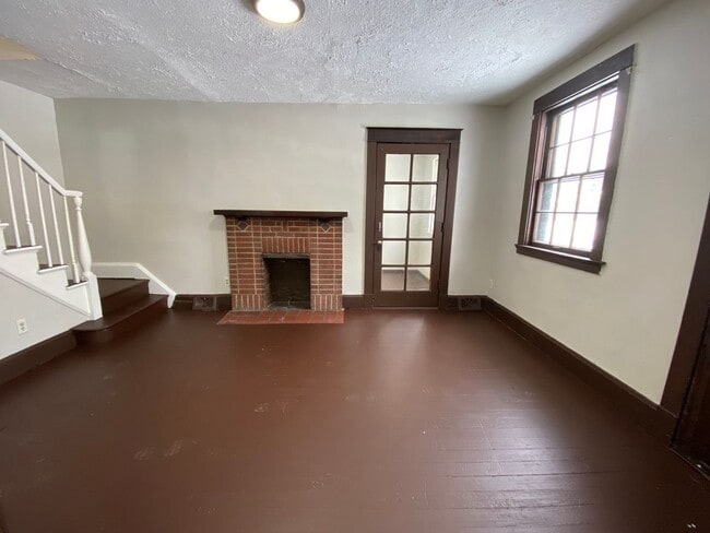Building Photo - Cozy Akron Home w/ Fireplace Charm, Detached Garage & Back Porch