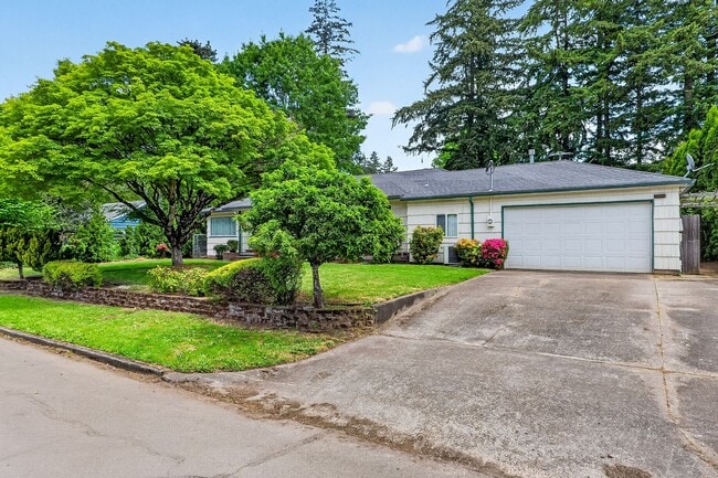 Building Photo - Charming Ranch Home with Hardwood Floors, Fireplace & Lush Curb Appeal