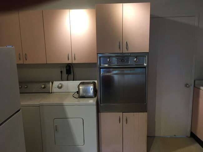 Kitchen showing washer dryer & wall oven - 35 Red Berry Rd