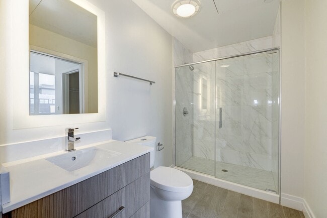 Spacious Bathrooms with LED Back-lit Mirrors - ZZZElysium Fourteen