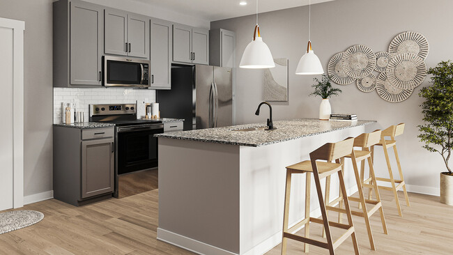 Experience the elegance of this modern kitchen, perfect for both cooking and entertaining. - South Bank at Quarry Trails