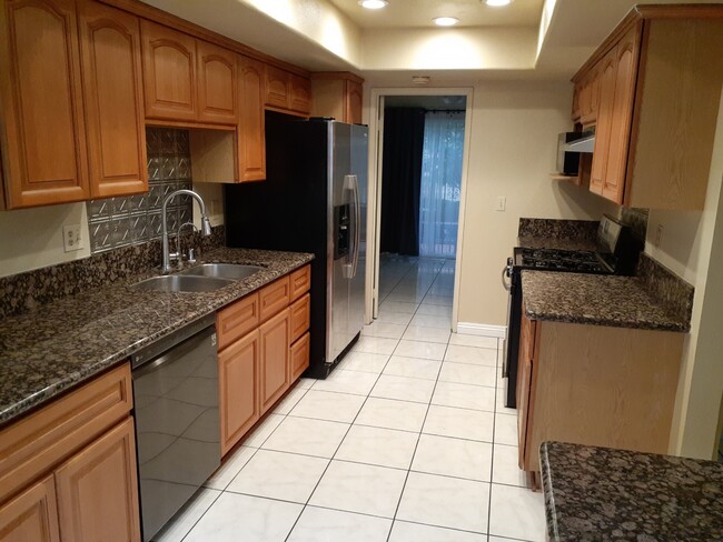 Kitchen leads to dining room - 599 S Parker St