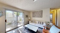 Located at 1700 Paseo Laguna Seco in Livermore, CA, this single-floor, 2-bedroom, 1-bathroom residence offers a practical and comfortable layout with thoughtful finishes throughout. The living room is bright and welcoming, featuring wood-style flooring, a textured ceiling, and a sliding glass door that opens to a private outdoor patio — filling the space with natural light and providing easy access to fresh air. A wall-mounted A/C unit ensures year-round comfort. The galley-style kitchen is efficiently designed with dark granite countertops, white cabinetry, stainless steel appliances including a dishwasher and refrigerator, and wood-style flooring that carries a clean, cohesive look. The primary bedroom offers carpeted flooring, a bright window with views to the outdoors, and a sliding-door closet for organized storage. The second bedroom, also carpeted, is a cozy and functional space. The bathroom features a dark granite vanity top, white cabinetry, a well-lit mirror, and wood-style flooring, reflecting the consistent design language found throughout the home. Two closets provide ample storage across the residence. This home combines efficient use of space with clean, modern finishes in a convenient Livermore location.