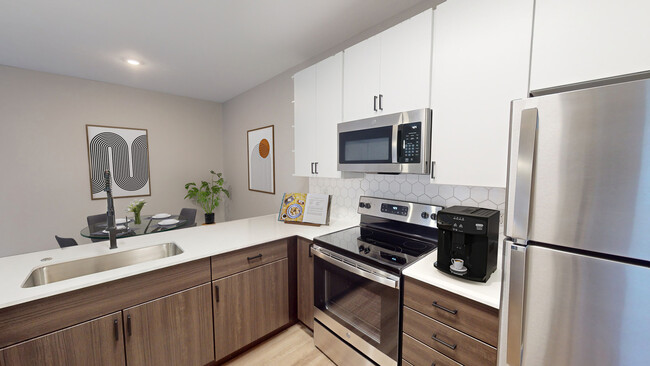 Newly Renovated Kitchen with Stainless Steel Appliances - The Chelsea Apartments