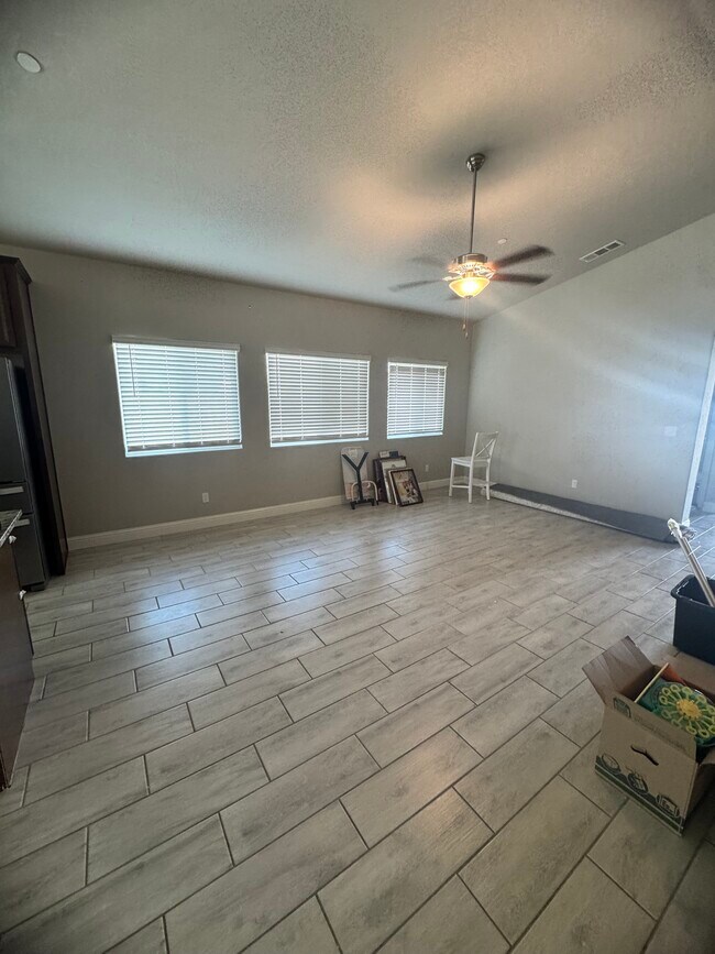 Main living space has an open concept. This is the livingroom - 11281 E Belmont Ave
