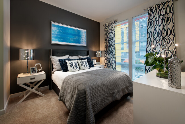 Bedroom with carpet and accent wall - Avalon Dunn Loring