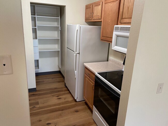 Kitchen with full pantry storage with shelves and built in microwave - 637 Fairmont Ave