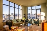 This contemporary 830 square foot apartment in Philadelphia offers a blend of modern design and urban comfort. The space is efficiently laid out across one floor, featuring two bedrooms and two bathrooms. The primary bedroom, at 210 square feet, provides ample space for relaxation.

The living area is a standout feature, boasting floor-to-ceiling windows that flood the space with natural light and offer panoramic city views. The open-plan design creates a seamless flow between the living, dining, and kitchen areas, ideal for both everyday living and entertaining.

Both bedrooms are well-appointed, with the master bedroom showcasing large windows and stylish furnishings. The bathrooms are sleek and modern, with one featuring a striking design of dark tiles contrasted with a terrazzo-style floor.

Throughout the apartment, there's a consistent aesthetic of clean lines and neutral tones, accented by pops of color in the furnishings. The kitchen, while not fully visible in the images, appears to be integrated into the main living space, maintaining the open and airy feel.

Climate control is ensured with wall-mounted air conditioning units, providing comfort year-round. The apartment's location at 1700 N Front St offers the convenience of city living with the tranquility of a private residence.

This apartment represents an ideal urban dwelling, combining functionality with style in a prime Philadelphia location.