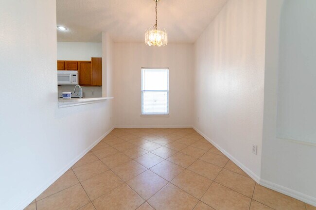 Building Photo - **Charming 4BR/2BA Pond-View Home with Boat Ramp Access – East Orlando **