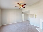 Located at 7000 Cook Rd in Houston, TX, this well-appointed 2-bedroom, 2-bathroom residence offers a functional and comfortable single-floor layout. The living room serves as the heart of the home, featuring a white brick fireplace, built-in shelving, plush carpeting, and a ceiling fan with light fixture. A pass-through opening connects the living area to the kitchen, creating an open and communicative flow ideal for everyday living and entertaining. The dining area transitions naturally from the kitchen, which is equipped with white cabinetry and standard appliances. Both bedrooms are carpeted and include ceiling fans, ample closet space, and windows that allow natural light and neighborhood views. The primary bedroom is generously sized and benefits from its own dedicated closet access. The two bathrooms are finished with clean white countertops, drop-in sinks, large mirrors, and overhead lighting. Additional conveniences include a dedicated laundry area and five closets throughout the unit, providing exceptional storage capacity. A private balcony extends the living space outdoors. Neutral wall tones and consistent finishes create a cohesive, move-in-ready atmosphere throughout the residence.