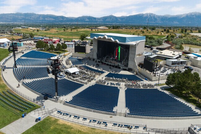 Usana amphitheater is an outdoor venue with a view of the mountains.