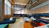 Located at 1150 Clay St in Oakland, California, this sophisticated amenity lounge delivers a compelling blend of art, architecture, and comfort across a single thoughtfully designed floor. The space immediately commands attention with a dramatic large-scale black-and-white mural that sweeps across a full accent wall, framed by rich black marble wainscoting with striking white veining. Warm wood paneling and slatted wood screens add an organic contrast to the polished concrete floors, lending the interior a grounded, modern character.

Soaring ceiling heights amplify the sense of openness throughout, while floor-to-ceiling sheer curtains diffuse natural light along the window-facing lounge area, where generously scaled tufted sectional sofas in deep emerald and navy invite relaxed gatherings. A circular pendant light anchors the main lounge zone, complemented by a sleek arc floor lamp. A built-in gas fireplace set into the marble feature wall adds warmth to the seating area furnished with contemporary swivel lounge chairs atop vibrant area rugs in amber and red tones. A work-ready bar counter with amber leather counter stools runs along the marble wall, ideal for casual collaboration. A billiards table rounds out the recreational offerings, making this a versatile and visually dynamic communal destination.