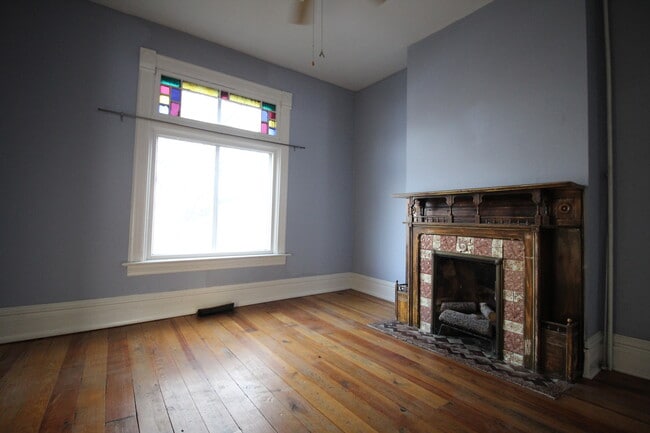 Originally the "parlor" in Victorian parlance, this space is now typically used as a bedroom - 1372 S 300 E