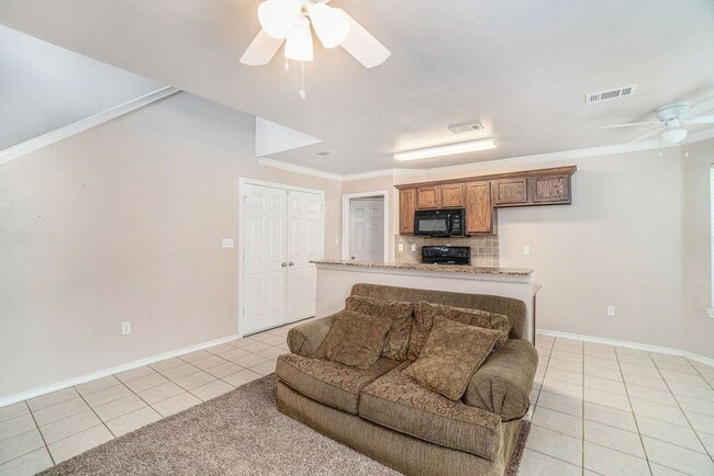 Building Photo - Beautiful two story townhome, crown molding, granite countertops, stained cabinets and carpeting ...