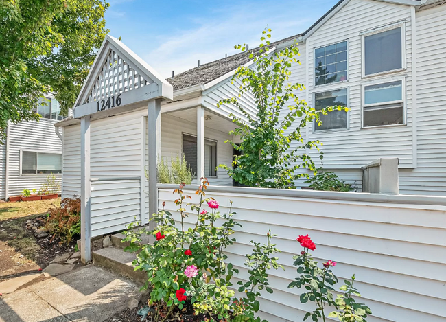 Building Photo - This Adorable Mill Park Townhome in a Grea...