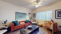 This single-floor residence offers a thoughtfully designed layout that balances comfort and functionality across its key living spaces. The living room serves as the heart of the home, featuring wood-look flooring, a ceiling fan with integrated lighting, and a large window dressed with vertical blinds that invites generous natural light. The open, airy feel of this space makes it ideal for both relaxing and entertaining.

The kitchen is equipped with an abundance of light wood cabinetry providing extensive storage, a double-basin sink beneath a window, clean white countertops, and a black dishwasher — offering a practical and efficient workspace.

The primary bedroom is a comfortable retreat, complete with a ceiling fan, wood-look flooring, mirrored sliding closet doors, and warm, neutral tones throughout. A second bedroom also benefits from natural light through a large window with vertical blinds and features wood-look flooring, providing a versatile space suitable as a guest room or home office.

The bathroom is finished with wood-look flooring, a tub-shower combination with white tile surround, and a vanity with warm wood cabinetry and a light countertop, offering a clean and functional design. Throughout the residence, consistent flooring and neutral wall tones create a cohesive, welcoming ambiance.
