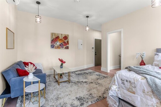 Sala de estar y estudio - Dearborn Apartments