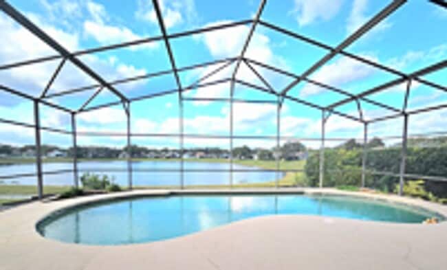 Building Photo - Lakefront home very spacious with a screened in pool in Heathrow