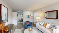 Located at 6719 Cliffdale Rd in Fayetteville, NC, this single-story 2-bedroom, 2-bathroom residence offers a thoughtfully designed layout with modern finishes throughout. The open living room is bright and welcoming, featuring wood-look flooring, neutral gray walls, multiple windows that invite natural light, and a textured ceiling. The kitchen is outfitted with white shaker-style cabinetry, granite countertops, and stainless steel appliances, providing both function and style. A dedicated office space adds flexibility to the floor plan. Both bedrooms are carpeted and include ceiling fans and ample closet storage; the primary bedroom features windows with outdoor views and generous proportions. The two bathrooms are well-finished, with one showcasing a granite-topped vanity, white cabinetry, wood-look tile flooring, and a tub/shower combination. A connecting hallway ties the layout together efficiently. The overall ambiance is contemporary and cohesive, with consistent neutral tones and clean lines creating a comfortable, move-in-ready environment suitable for a variety of lifestyles.