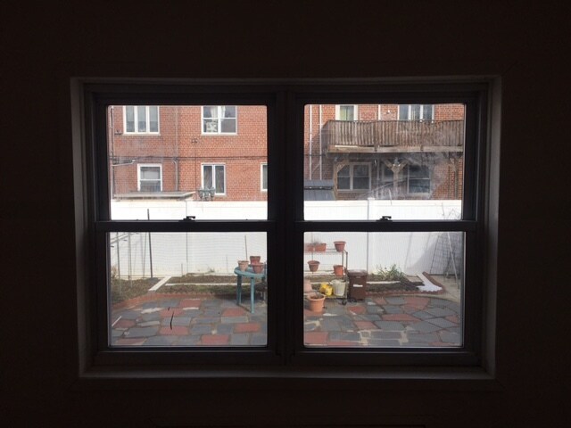 Bedroom with two large winders facing east, view backyard. - 2645 Batchelder St
