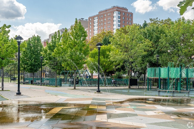 Parks and playgrounds sit in front of apartments in South Bronx.