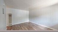 Located at 2927 Marconi Ave in Arden-Arcade, California, this efficient single-story, one-bedroom, one-bathroom unit offers a well-designed layout that maximizes every square foot. Durable wood-look flooring flows consistently throughout the space, lending a cohesive and modern feel.

The kitchen is thoughtfully equipped with white shaker-style cabinetry, granite-look countertops, a stainless steel refrigerator, and an electric range, providing all the essentials for comfortable daily living. The open sightline from the kitchen into the main living area enhances the sense of space.

The bedroom is a comfortably sized retreat featuring soft gray walls, a ceiling fan with light fixture, a window with natural light, and a sliding-door closet offering ample storage. An adjacent hallway reveals additional built-in shelving, adding practical storage options beyond the main closet.

The bathroom is clean and functional, finished with wood-look flooring, a white vanity, and a tub-shower combination with a window positioned above for natural ventilation and light.

Throughout the unit, neutral gray tones, white trim, and consistent flooring create a bright, clean aesthetic. The layout is efficient and accessible, making this a practical and move-in-ready space in the Arden-Arcade neighborhood of Sacramento.