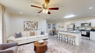 Located at 2247 Wellspring Dr in Beaumont, Texas, this single-story home offers a thoughtfully designed layout with modern finishes throughout. The open-concept living, dining, and kitchen area forms the heart of the home, with light wood-look tile flooring and recessed lighting creating a bright, welcoming ambiance. Ceiling fans in the living room and bedroom provide added comfort. The kitchen is well-equipped, featuring white shaker-style cabinetry, gray countertops, stainless steel appliances, and a central island with bar seating — ideal for both cooking and casual dining. A separate dining area provides additional space for meals and entertaining. The bedroom is a comfortable retreat, complete with plush carpeting, a ceiling fan, a large window with outdoor views, and a spacious closet. The full bathroom offers a white vanity with ample storage and wood-look tile flooring. A dedicated laundry room houses a full-size washer and dryer beneath overhead cabinetry for added storage. The home also features a fenced backyard with a lawn and open views of the surrounding landscape, offering a peaceful outdoor space under the Texas sky.