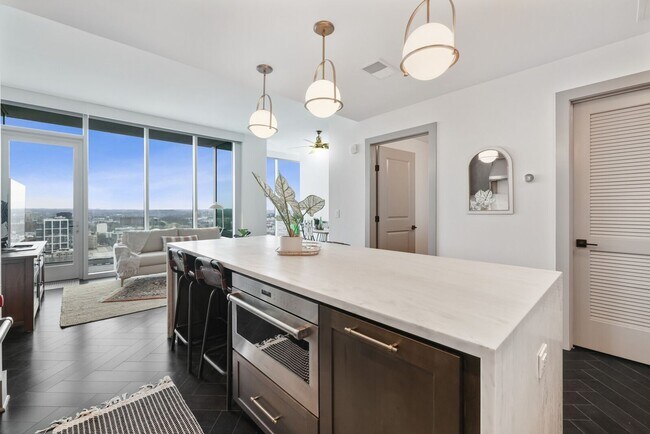 Building Photo - High-Rise Living 1st Month FREE