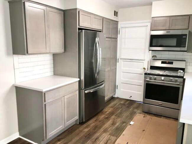 New cabinets New appliances and Quartz countertop dishwasher - 5338 W Sunnyside Ave