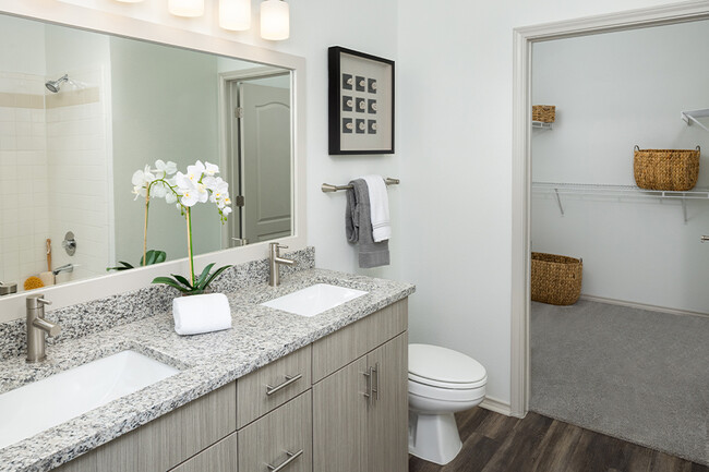 Bathroom upgrades include double vanities, undermount sinks and premium granite countertops - The Madison Apartments