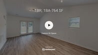 Located in the Hunter's Run community of Raleigh, NC, this single-floor home offers a clean, modern aesthetic throughout. Light wood-style flooring runs continuously across the living areas, complementing the bright white walls and creating a cohesive, airy feel. The living room stands out with vaulted ceilings that add a sense of generous vertical space, track lighting, and French doors that flood the room with natural light while providing direct access to the outdoors. An adjacent dining area benefits from the same vaulted ceiling and a window overlooking the exterior. The kitchen is well-appointed with white shaker-style cabinetry, white quartz countertops, stainless steel appliances including a refrigerator and dishwasher, a double-basin sink beneath a window, and a peninsula that offers additional prep and serving space. A dedicated pantry closet provides ample storage. The bathroom features a white vanity with a single sink, brushed nickel fixtures, a framed mirror, and modern vanity lighting. A walk-in closet is accessible directly from the bathroom, offering practical storage. The overall layout, as seen in the dollhouse view, is open and efficiently organized, making excellent use of the single-floor footprint throughout the home.