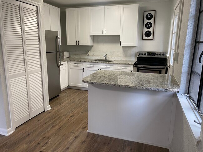 Open kitchen. Black splash to be installed this week. Will update pic once completed - 602 Florida St