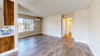 Located at 6244 Hazel Ave in Orangevale, California, this one-bedroom, two-bathroom unit offers a well-organized and functional layout across a single floor. The living room serves as the heart of the home, featuring warm wood-look hardwood-style flooring, neutral beige walls, a textured ceiling, and a wall-mounted mini-split air conditioning unit for year-round comfort. A large window allows natural light to fill the space while offering views of the surrounding trees. The galley-style kitchen is efficiently designed with rich wood cabinetry, a stainless steel refrigerator, wood-look flooring, and a window that brings in additional natural light — making the space feel open despite its compact footprint. The bedroom features plush carpeting, a window with tree views, and full mirrored sliding closet doors that enhance the sense of space. Both bathrooms are clean and functional, with one featuring a tiled shower-tub combo, wood-look flooring, and classic white fixtures. Throughout the unit, warm neutral tones and consistent finishes create a cohesive and inviting ambiance, making this Orangevale residence a comfortable and practical place to call home.