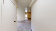 Located at Bayard Road in Pittsburgh's Oakland neighborhood, this single-floor unit offers three bedrooms, one bathroom, a kitchen, and two hallways connected by a practical layout. Soft carpet runs throughout the living areas and bedrooms, lending a warm, comfortable feel underfoot. The spacious primary bedroom stands out with two closets, a ceiling fan with light fixture, dual windows with vertical blinds, and baseboard heating — providing ample storage and natural light. The additional bedrooms are well-proportioned and bright, each featuring carpet flooring and baseboard heating. A connecting hallway links the rooms efficiently, with closet storage also accessible along the way. The kitchen is equipped with warm wood cabinetry, granite-style countertops, a gas range, and tile flooring, along with a window overlooking the outdoors. The bathroom features classic white tile walls, a pedestal sink, a mirrored vanity with overhead lighting, tile flooring, and a full bathtub with shower. Throughout the unit, neutral wall tones and clean lines create a simple, move-in ready aesthetic well-suited for students or professionals near Pittsburgh's universities and medical centers.