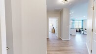 Located at 1325 Terrill Rd in Scotch Plains, NJ, this well-appointed 2-bedroom, 2-bathroom single-floor residence offers a thoughtfully designed open-concept layout with contemporary finishes throughout. Light wood-tone flooring flows seamlessly across the entire home, lending a warm, cohesive feel to every room.

The kitchen is a standout space, featuring crisp white cabinetry, stainless steel appliances, grey countertops, a subway tile backsplash, and a peninsula with bar seating illuminated by elegant brass pendant lights. It opens directly into the dining area, where oversized windows and sheer blue curtains frame bright outdoor views, and into the living room, which benefits from generous natural light through large picture windows.

A welcoming hallway with a sputnik-style ceiling fixture connects the living spaces to the private quarters. The spacious primary bedroom offers large windows with outdoor views, providing ample natural light and a calm retreat. The second bedroom is equally well-proportioned and bright. Both bedrooms are complemented by closets, and the two bathrooms are finished with clean, neutral tile and modern fixtures.

The home also features a tastefully styled entryway area and recessed lighting throughout, contributing to the overall bright and modern ambiance of this move-in-ready residence.