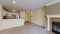 Located at 27603 Remington Cir in Westlake, Ohio, this single-floor residence offers a well-designed, open-concept layout that maximizes comfort and functionality. The living area is generously sized, featuring soft wall-to-wall carpeting, warm neutral tones, and multiple windows that invite natural light throughout the space. A ceiling fan adds both practicality and subtle style to the bedroom, which also benefits from natural light through a large window overlooking greenery outside.

The kitchen is a standout feature, outfitted with crisp white cabinetry — including a dedicated wine rack — rich granite-style countertops, and a full suite of stainless steel appliances, including a refrigerator, electric range, over-the-range microwave, and dishwasher. Wood-look flooring grounds the kitchen, which flows seamlessly into the living area via a convenient breakfast bar peninsula.

The bathroom mirrors the kitchen's aesthetic with matching granite-style countertops, white cabinetry, wood-look flooring, and a tiled tub/shower combination with a curved shower rod. A large mirror above the vanity adds a sense of openness to the space. Throughout the residence, soft yellow-toned walls create a warm and inviting ambiance, complemented by clean white trim and recessed lighting.
