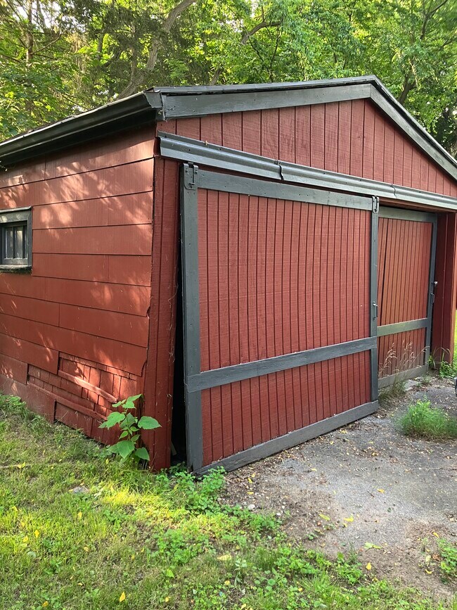 Recently painted barn acting as two car garage - 15 Washington Rd
