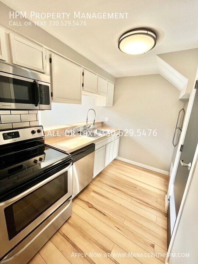 Building Photo - Water Street Apartments - first month rent...