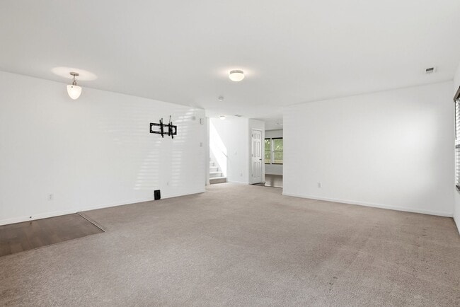 Building Photo - Spacious 4BR Home with New Carpet & Fenced Backyard