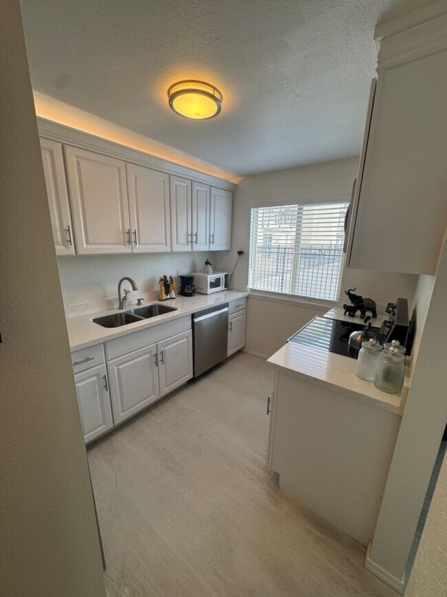 Building Photo - Gorgeous Condo in Seward Park with 2 Parking Spaces, Steps Away from Pool with Water View!